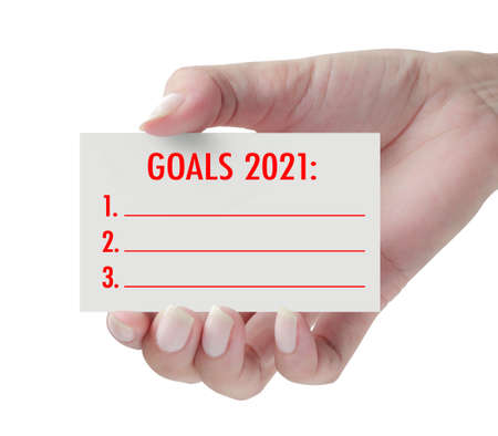 New Year goals 2021 with hand. New year is the first day of the year in the Gregorian calendar.