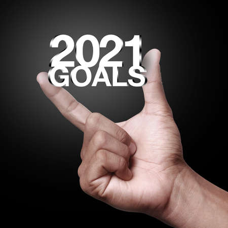 New Year goals 2021 with hand. New year is the first day of the year in the Gregorian calendar.の写真素材