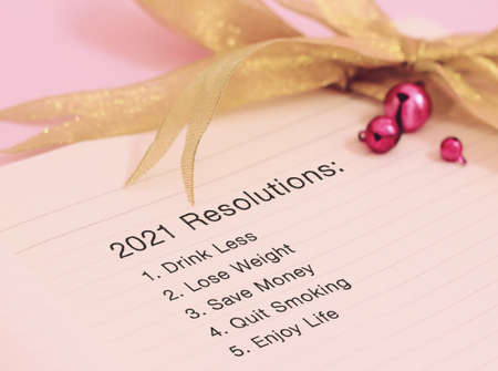 Resolutions 2021 with beautiful decoration. Discover how setting goals can bring more happiness in your life.の写真素材
