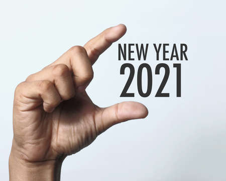 Happy new year 2021 with hand. New year is the first day of the year in the Gregorian calendar.の写真素材