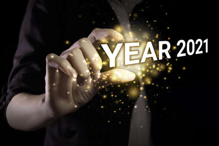 Happy new year 2021 with hand. New year is the first day of the year in the Gregorian calendar.の写真素材