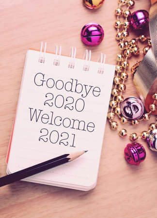 Goodbye 2020 welcome 2021 with decoration. We wish you a new year filled with wonder, peace, and meaning.の写真素材