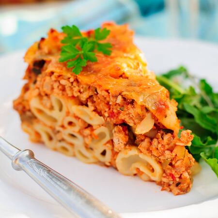 A Piece of Bolognese Pasta Bake, Macaroni Cheese, Minced Meat and Pasta Pie, close up, squareの写真素材