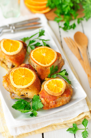 Chicken Thighs Roasted with Oranges Slices and Spices, copy space for your textの写真素材