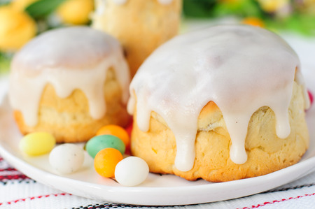 Kulitch (Kulich), Russian Easter Bread Topped with Sugar Icing Decorated with Easter Eggs Candies,...