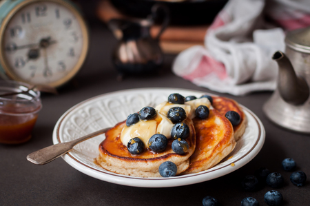 Fluffy Wholemeal Pancakes with Mascarpone and Fresh Blueberries, Alarm Clock, Breakfast Timeの写真素材