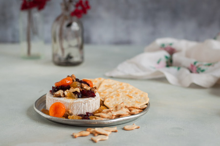 Dried Fruit (Apricots, Cranberries and Sultanas), Walnut and Honey Baked Brie with Crackers, copy space for your textの写真素材