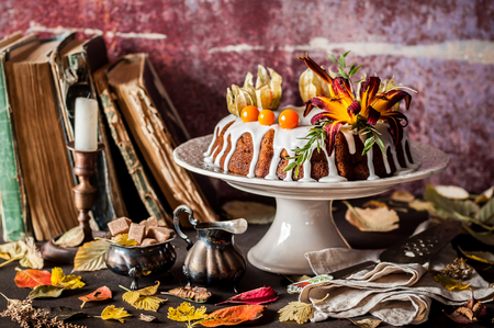Autumn Harvest Banana Bundt Cake Decorated with Flowers and Physalis, Leaf Fallの写真素材