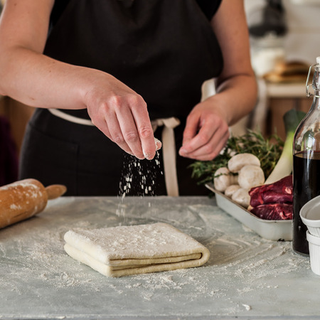A Woman Making Puff Pastry Dough for Meat Pies, squareの写真素材
