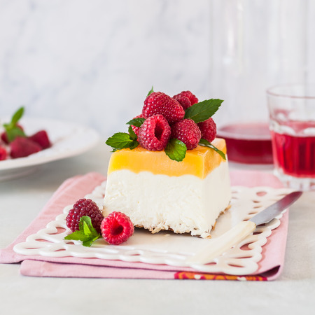 Lemon Curd Semifreddo, Ice Cream Cake Decorated with Fresh Raspberries and Mint, squareの写真素材