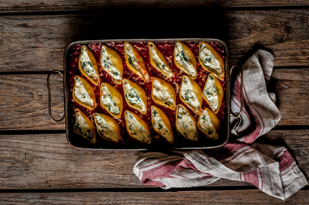 Baked Cheese and Spinach Stuffed Pasta Shells, copy space for your textの写真素材
