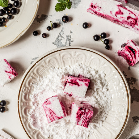 Blackcurrant Swirl Marshmallow in a Plate with Icing Sugar, squareの写真素材