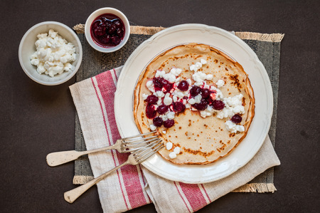 Thin Crepes with Cottage Cheese and Cranberry Jam, copy space for your text
