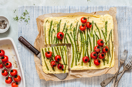 Sliced Asparagus Ricotta Frittata with Roasted Cherry Tomatoes and Micro Greensの写真素材
