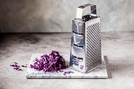Grating Red Cabbage on a Marble Board, copy space for your textの写真素材