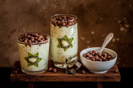 Kiwifruit Smoothie Decorated with Star Shaped Kiwi Slices with Cocoa Cerealの写真素材