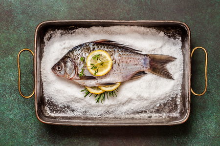 Whole Crucian To Be Baked in Saltの写真素材