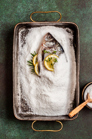 Whole Crucian To Be Baked in Saltの写真素材