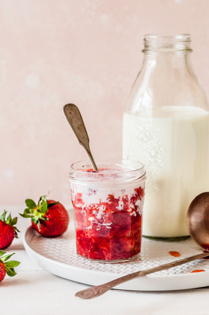 Fresh Crushed Strawberries with Milk in a Jar, copy space for textの写真素材