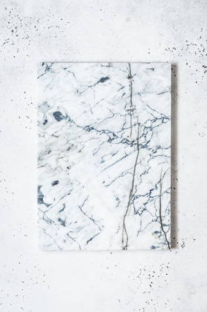 Marble Board on Light Grey Concrete Background, copy space for your textの写真素材