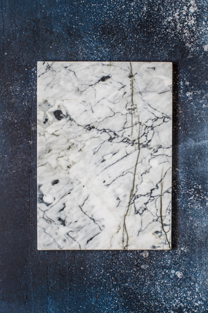 Marble Board on Dark Blue Concrete Background, copy space for your textの写真素材