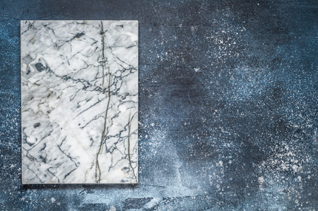 Marble Board on Dark Blue Concrete Background, copy space for your textの写真素材