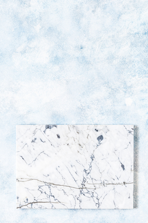 Marble Board on Blue Concrete Background, copy space for your textの写真素材