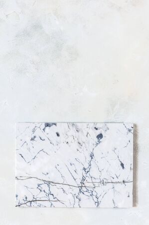 Marble Board on Light Grey Concrete Background, copy space for your textの写真素材