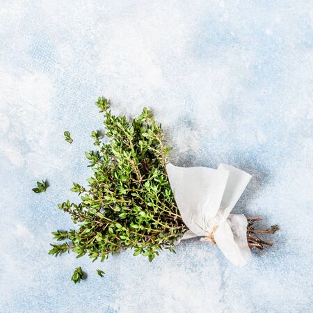 A Bunch of Fresh Thyme Wrapped in Paper, square, copy space for your textの写真素材
