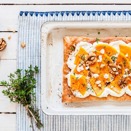 Puff Pastry Butternut Squash and Cheese Tart with Walnuts and Thyme, copy space for your textの写真素材