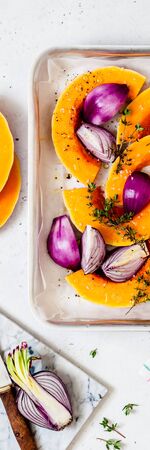 Butternut Squash Slices with Red Onions and Thyme Prepared for Roasting, bannerの写真素材