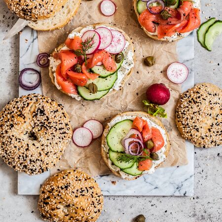 Bagel Sandwiches with Cream Cheese, Salmon and Vegetables, squareの写真素材