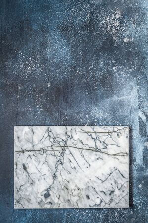 Marble Board on Dark Blue Concrete Background, copy space for your textの写真素材