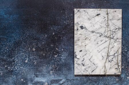 Marble Board on Dark Blue Concrete Background, copy space for your textの写真素材