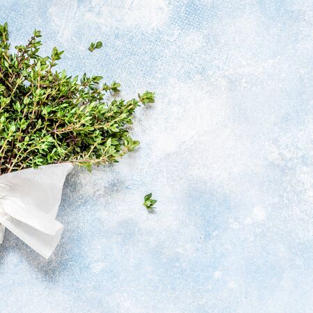 A Bunch of Fresh Thyme Wrapped in Paper, square, copy space for your textの写真素材