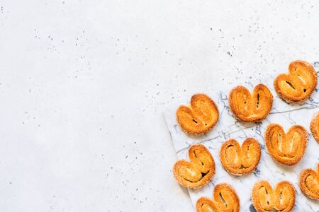 Palmier, Puff Pastry Biscuits, French Elephant Ear Cookies, copy space for your textの写真素材