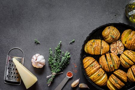 Roasted Paprika and Thyme Hasselback Potatoes, copy space for your textの写真素材