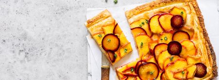 Peach, Plum and Thyme Puff Pastry Tart, banner, copy space for your textの写真素材