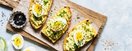 Mashed Avocado and Boiled Egg Toasts with Chives and Black Sesame Seeds, banner