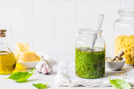 Pesto Sauce with  Ingredients: Fresh Basil, Pine Nuts, Olive Oil and Cheese, copy space for your textの写真素材