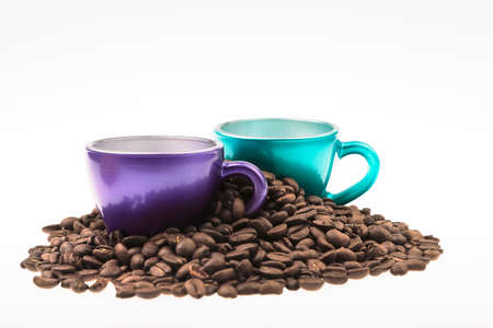 Cups of coffee with a heap of coffee beansの写真素材