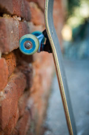 Skateboard leaning against wallの写真素材
