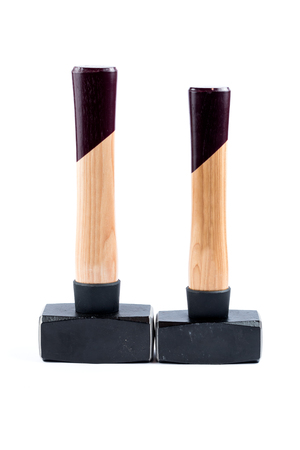 Two sledgehammers with wooden handle isolated on a white background. Construction tools. New sledgehammer.の写真素材