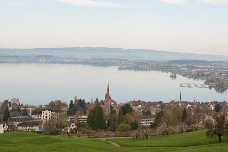 Landscape photograph of small city Zug near lake in morning in Switzerland. Aerial image of Zug city.の写真素材