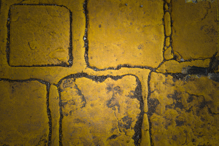 Old yellow granite road cubes as background or wallpaper. Dark edgesの写真素材