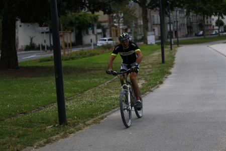 Pro biker on a bike road/path alone doing his daily routine.のeditorial素材