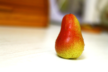 Pear front close up shot in the kitchen, on daylight with bokeh background.の写真素材