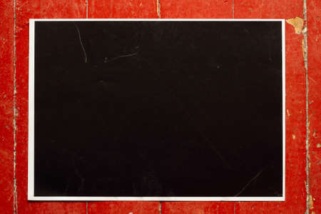 sheet of black paper on the old boardsの写真素材