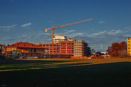 Milan, Italy 28.11.2023 A multi-storey residential building under construction against the backdrop of a lawn in the suburbs of Milan, Italyのeditorial素材