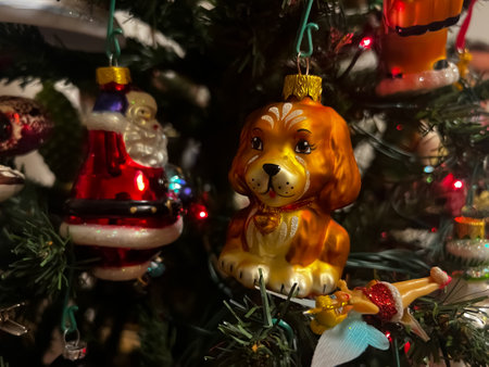 Beautiful festive glass decorations on the Christmas tree. Close-up. Beautiful Christmas background. The concept of decorations and decor for the new year. New Year card 2024. High quality photoの写真素材